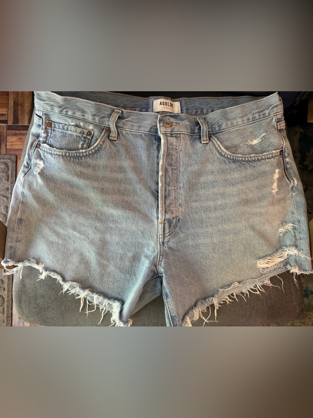 Agolde Light Blue Distressed Denim Shorts with Frayed Hem